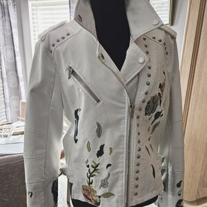 Ladies  size L (runs a bit small) leather and hand embroidered